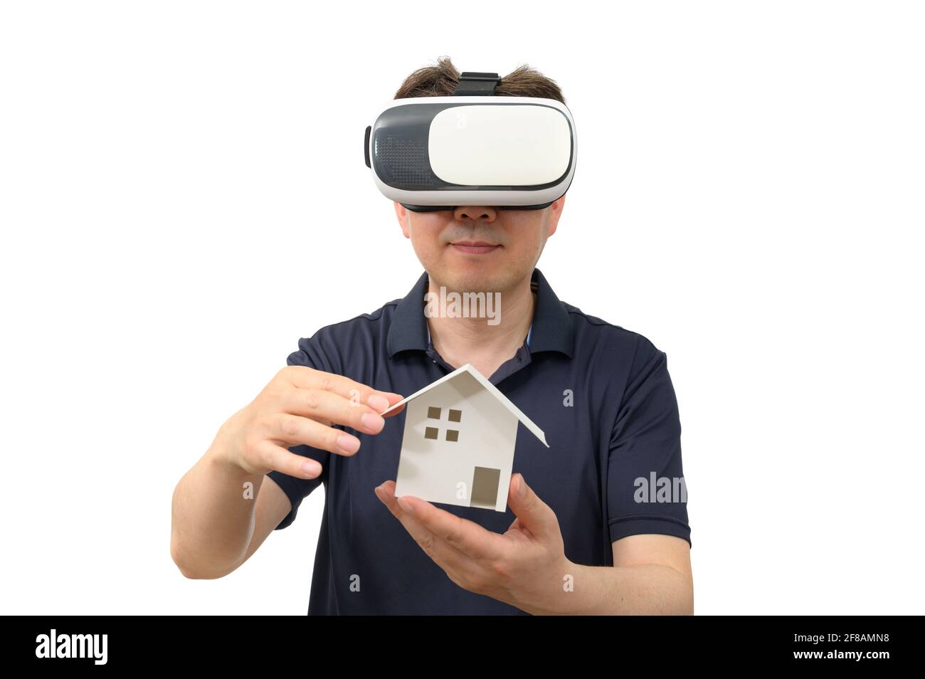 Man wearing virtual reality goggles. Studio shot, white background. Stock Photo