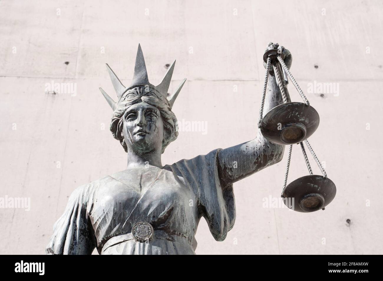 Statue of Lady Justice holds aloft the sales of justice Stock Photo