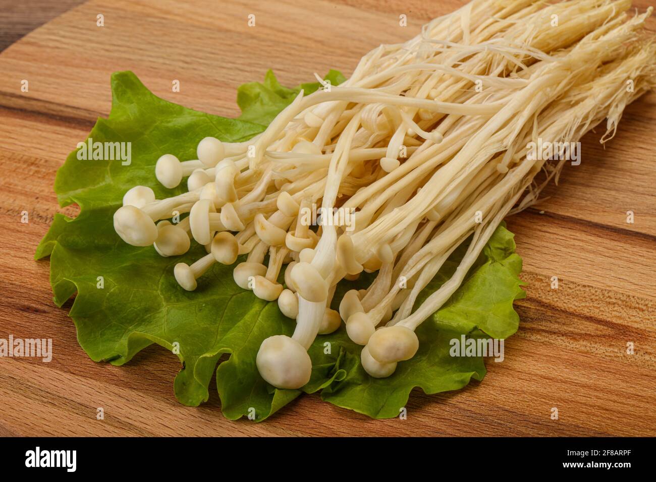 Raw Japanese Enoki mushrooms for cooking Stock Photo Alamy