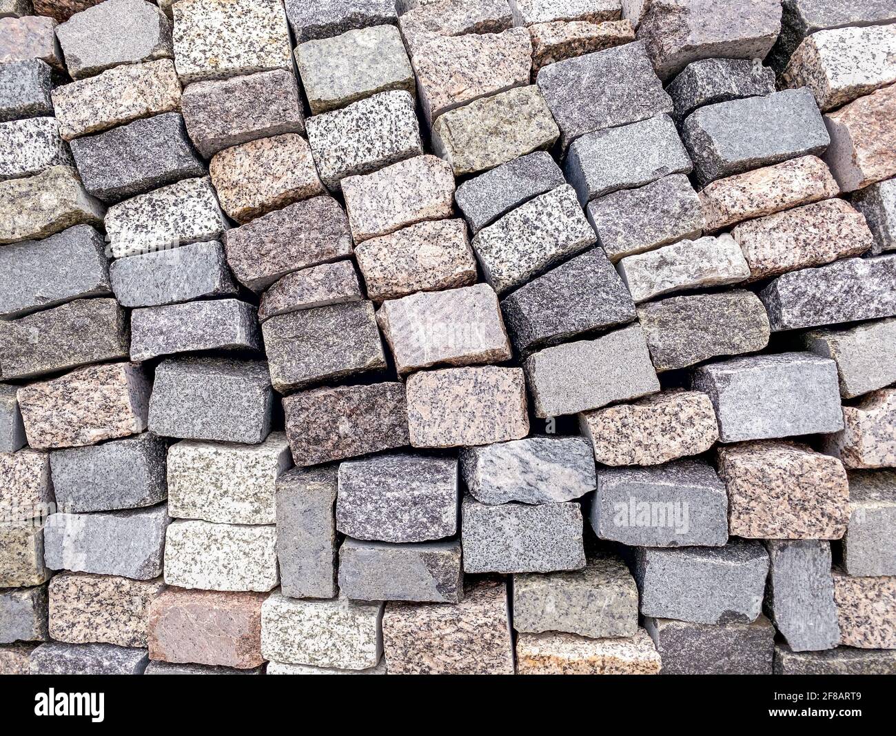 stacked grey granite stone tile for pavement construction. natural
