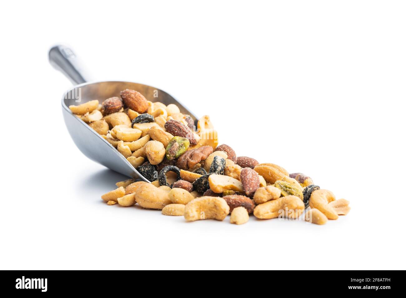 Mix of salted nuts in sccop isolated on white background. Stock Photo