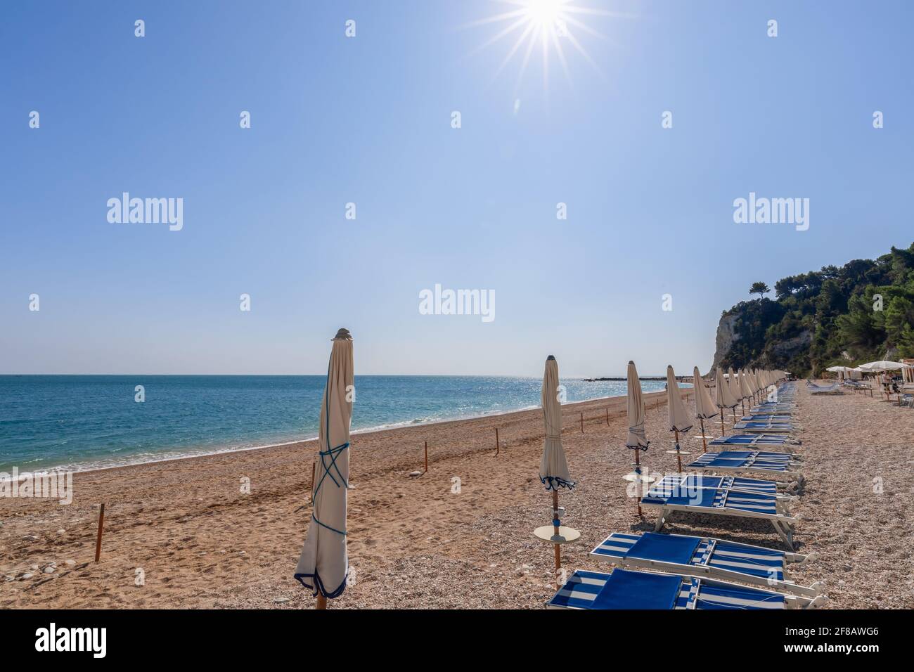 View of empty San Michele beach waiting for tourists. Conero, Marche, Italy Stock Photo
