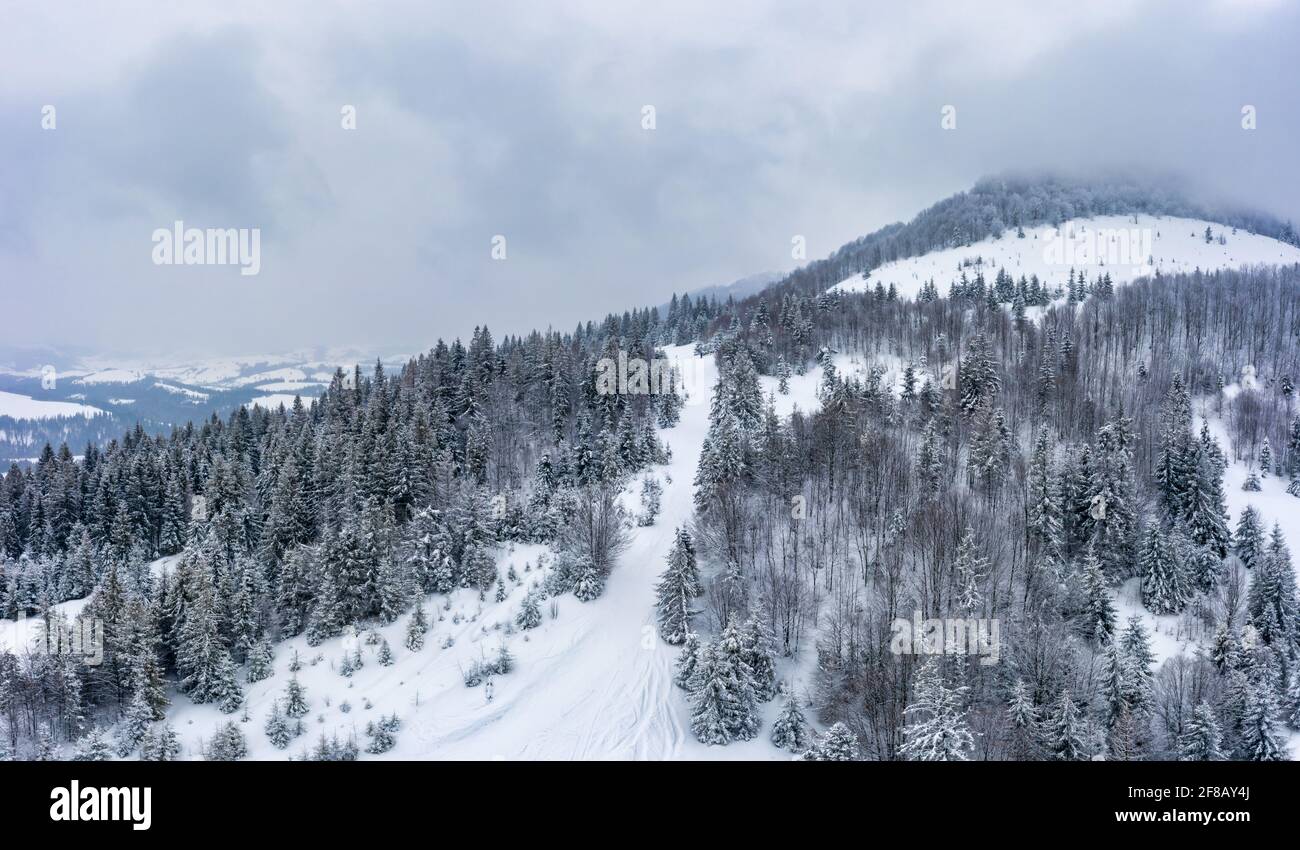 Wonderful landscapes of the Carpathian mountains covered with the first snow in Ukraine near the village of Pylypets Stock Photo