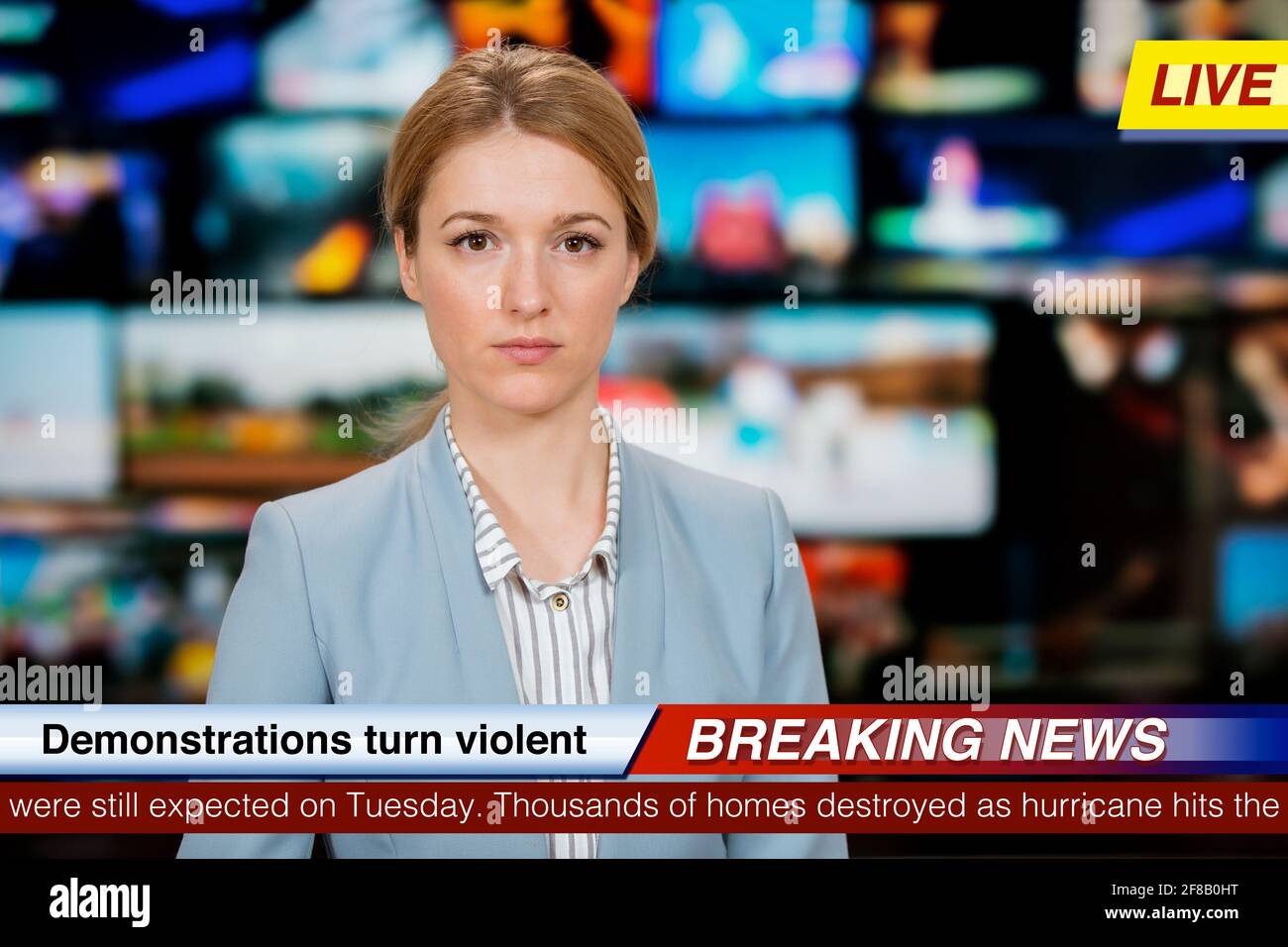 An Anchorwoman Reporting Live Breaking News Sitting In Tv Studio An Anchorwoman Reporting Live Breaking News Sitting In Tv Studio