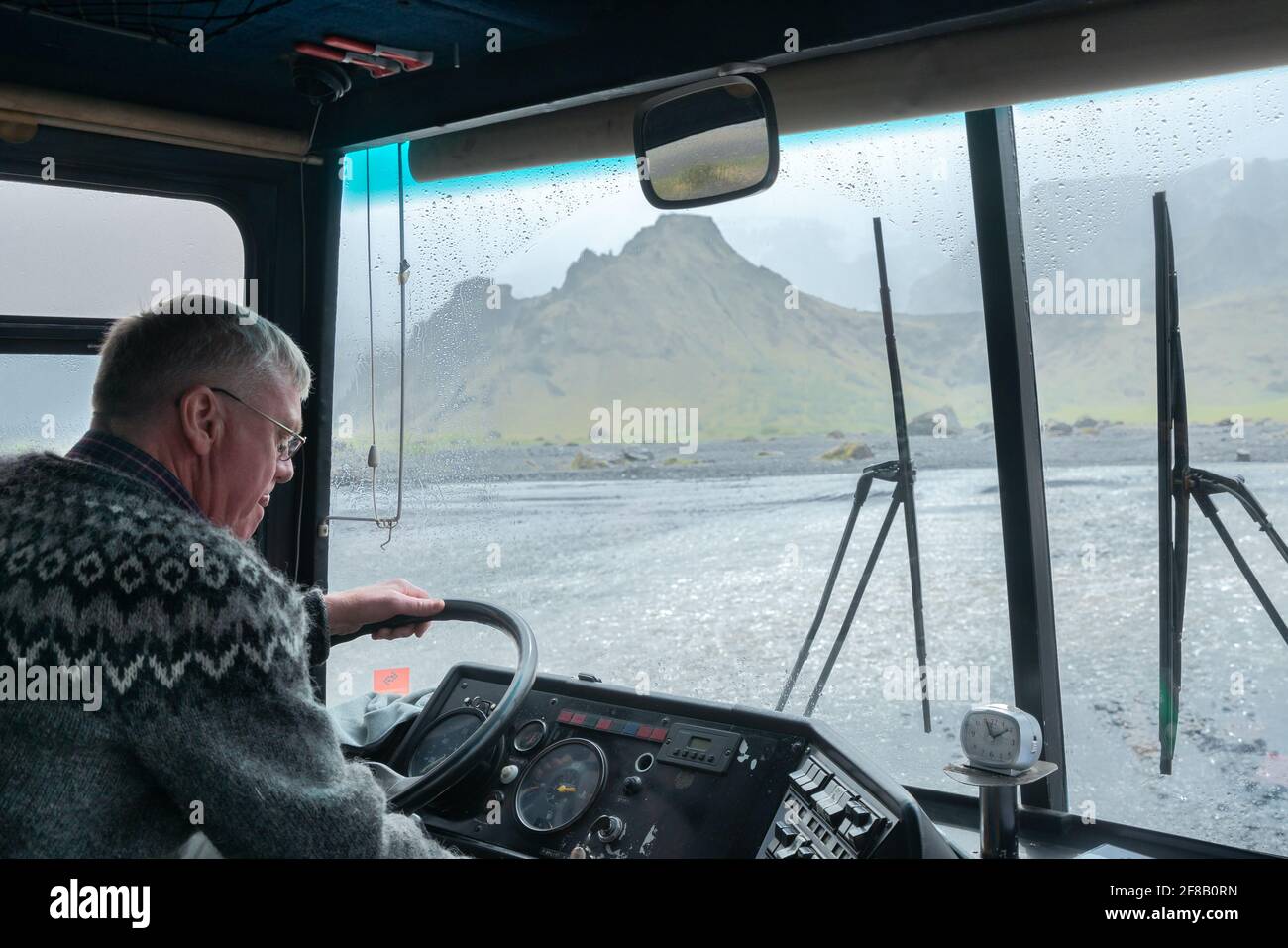 Thorsmork,Iceland-06.05.2019: Driver of an off-road bus pays close attention when crossing river in Thorsmork valley, Southern Iceland. Stock Photo