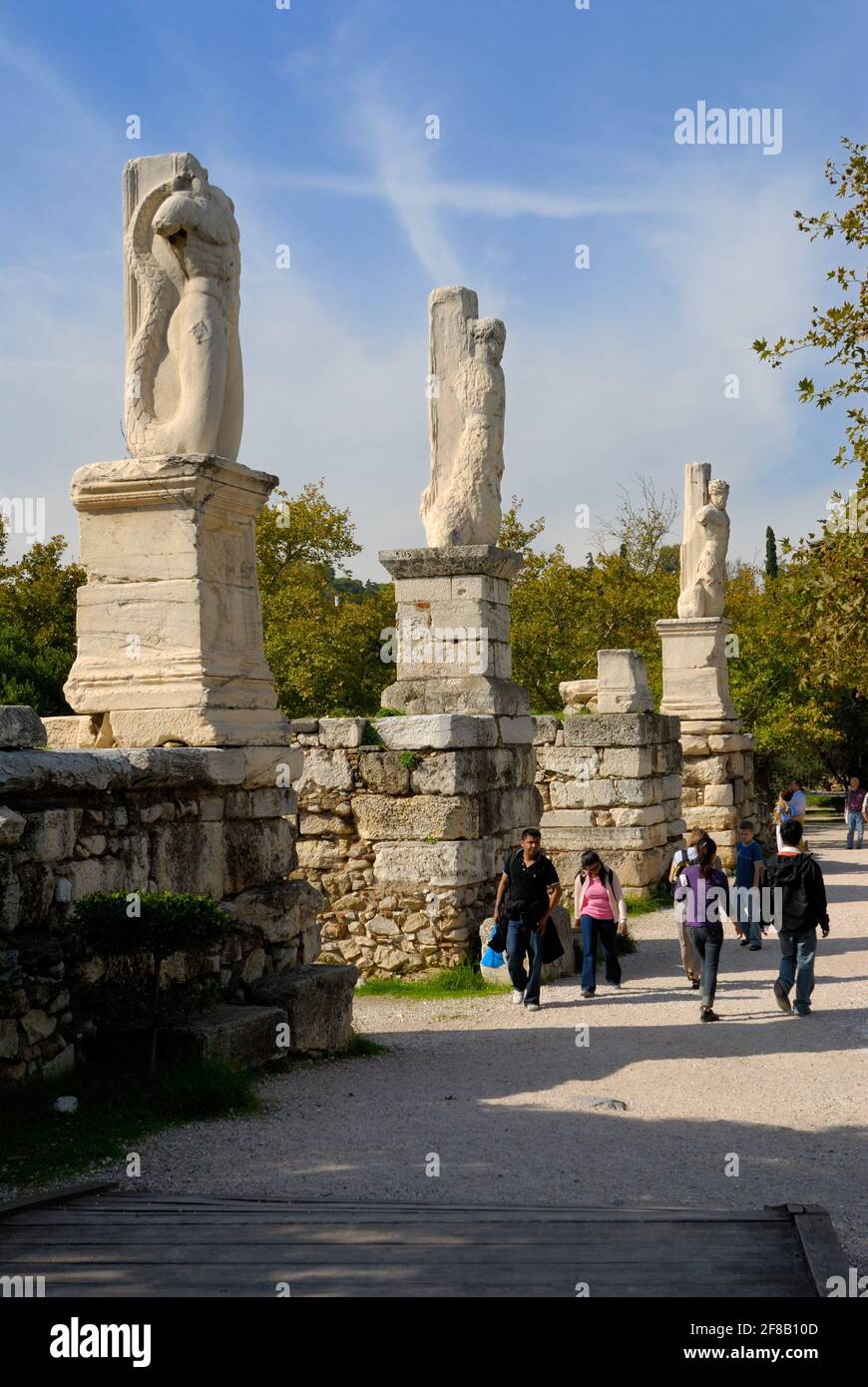 ancient agora marble statues as columns of ancient buildings , Athens