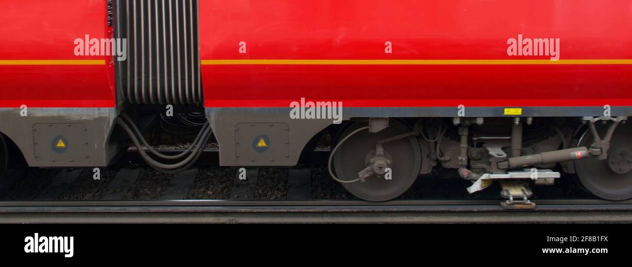 Banner showing side view of lower part of train carriage and wheels. High quality photo Stock Photo