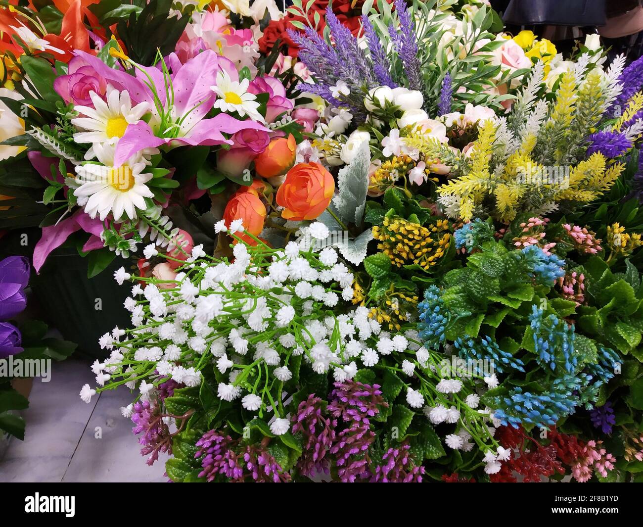 Artificial flowers.Beautiful and bright background close-up. Horizontal color photo Stock Photo