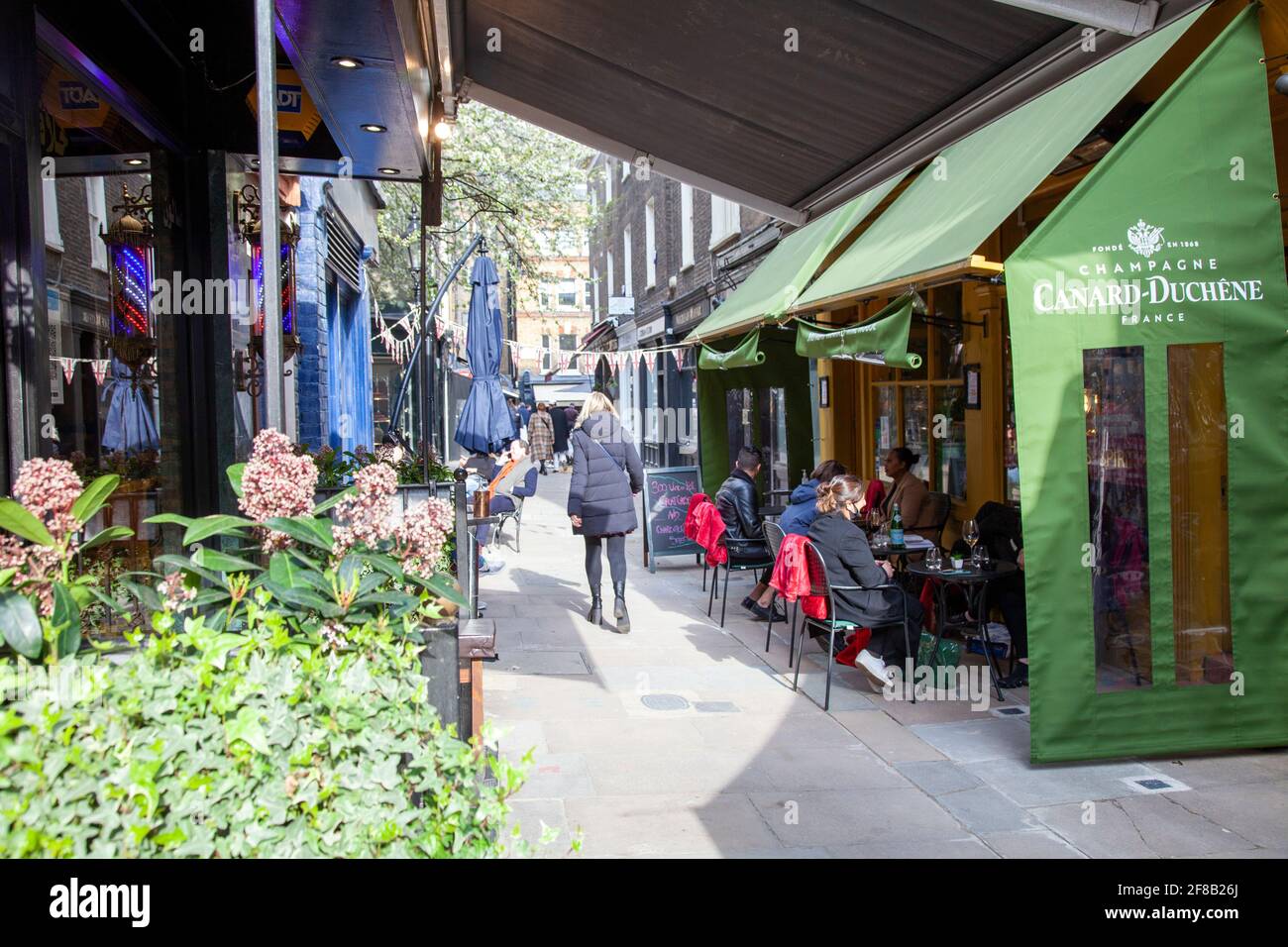 First Day after Lockdown, 12 April 2021, People Drining and Dining on Shepherds Walk, W1 - London UK Stock Photo