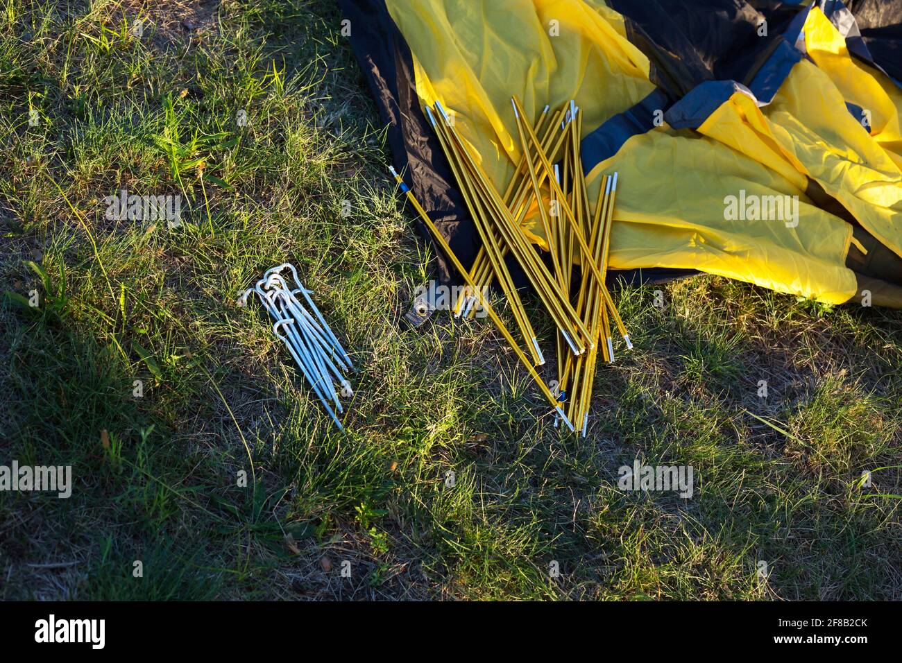 Aluminum mounting arcs, pegs for installation tourist yellow tent and waterproof cloth on ground