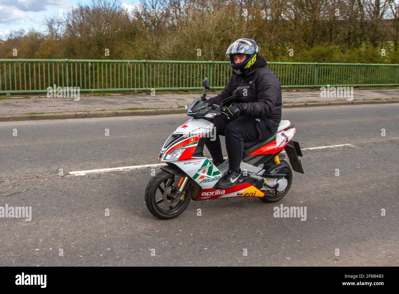 2011 Aprilia Sr 50r Scooter; Motorbike rider; two wheeled transport,  motorcycles, vehicle on British roads, motorbikes, motorcycle bike riders  motoring in Manchester, UK Stock Photo - Alamy