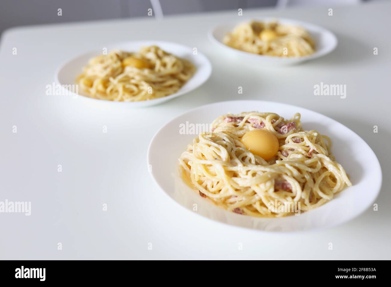 Cooked dish with pasta, egg and bacon Stock Photo Alamy