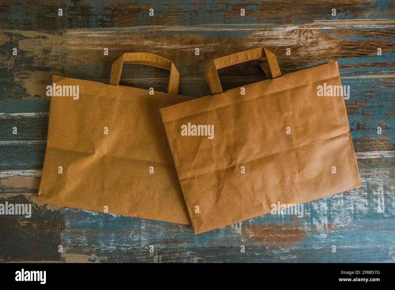 paper bags on a wood material surface Stock Photo