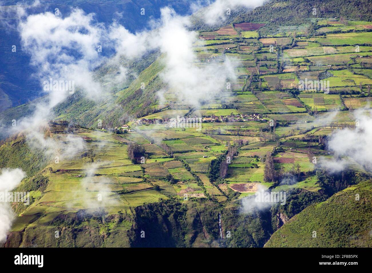 Village and terraced field in peru, view from Choquequirao trekking trail, Cuzco area, Machu Picchu area, Peruvian Andes Stock Photo