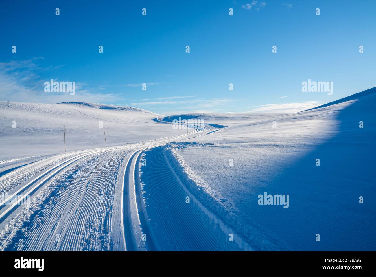 Cross country skiing tracks in a Nordic mountain terrain. Stock Photo