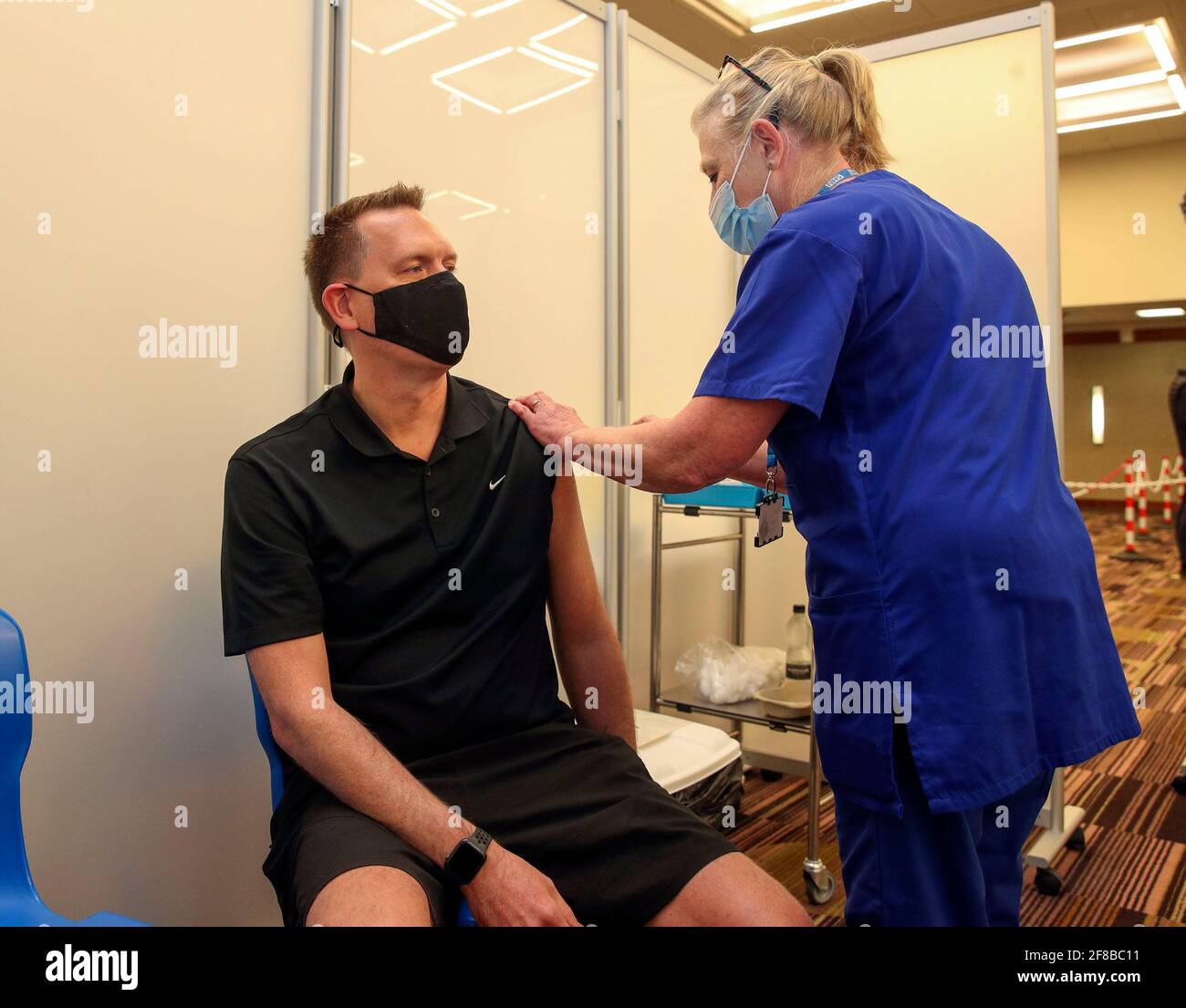 Martin Pluves from Wokingham receives an injection of the Moderna Covid ...