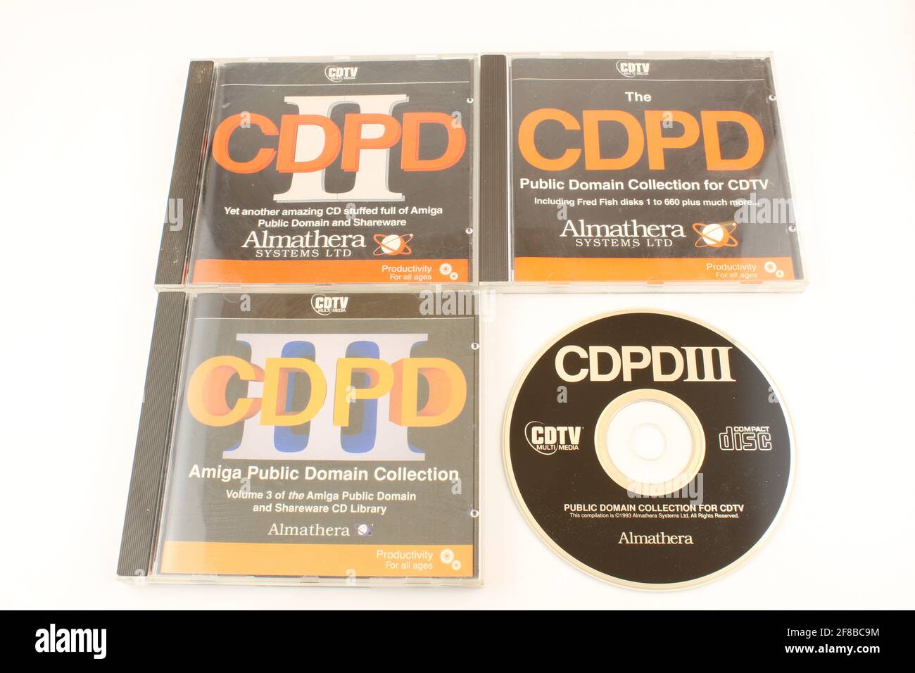 Collection of Amiga public domain and share ware CDs by Almathera systems ltd. Old tech Stock Photo