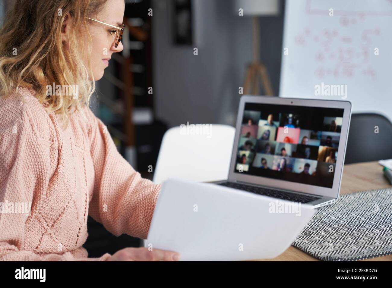 Young female teacher teaching remotely at home Stock Photo - Alamy