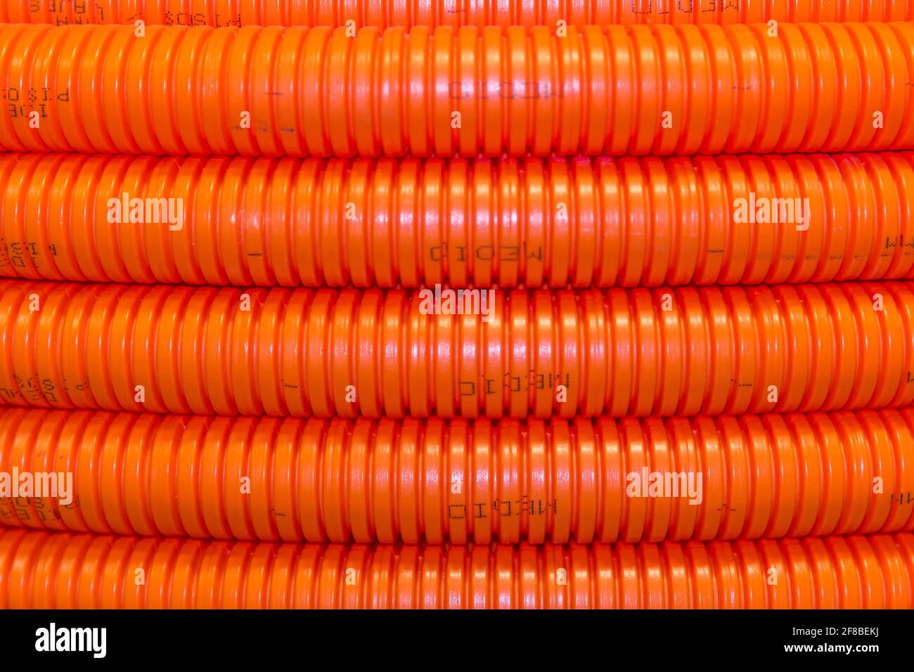 Closeup of orange electrical wire conduit Stock Photo Alamy