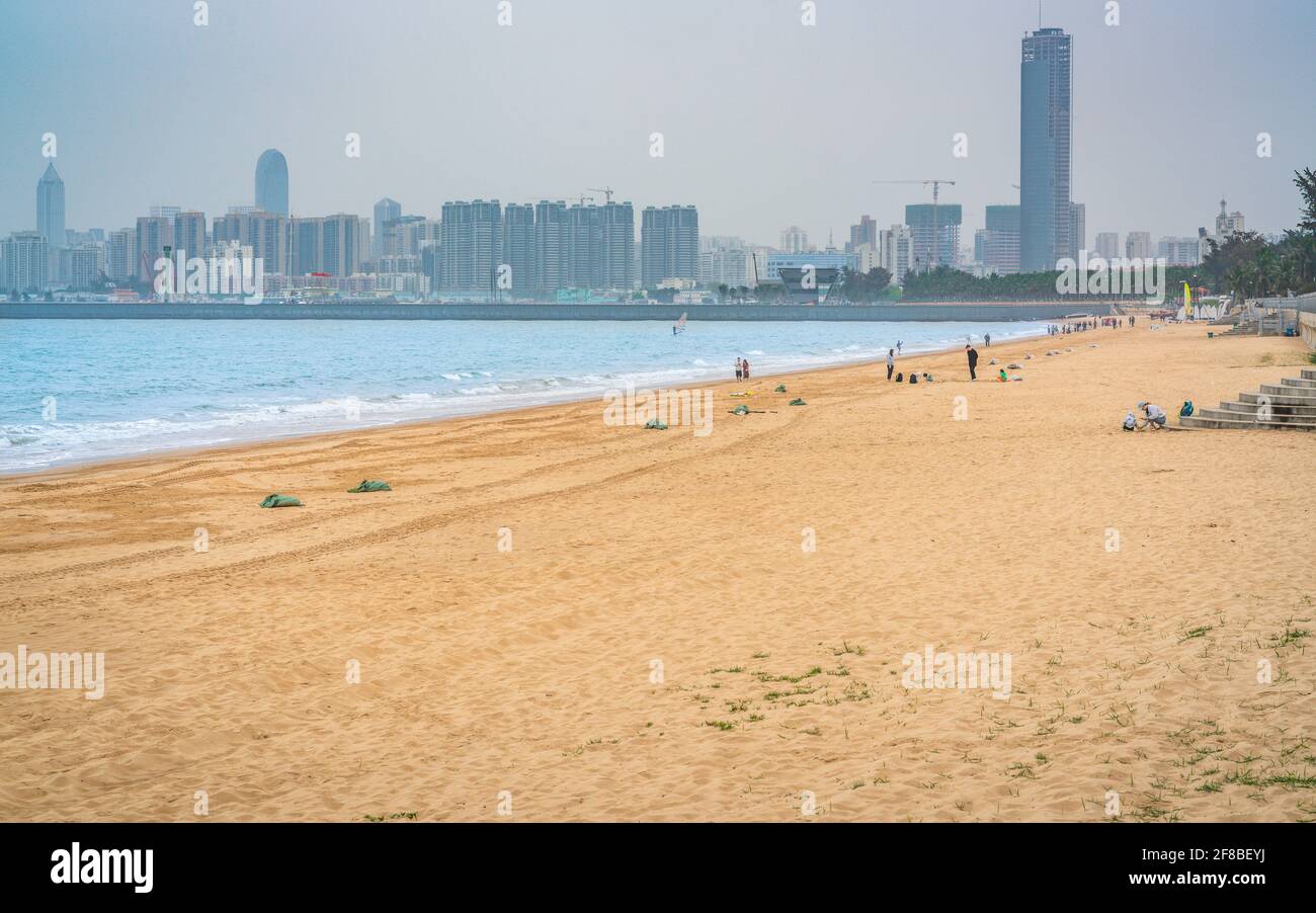 Haikou Xixiu beach view and city skyline in the distance in Haikou Hainan China Stock Photo