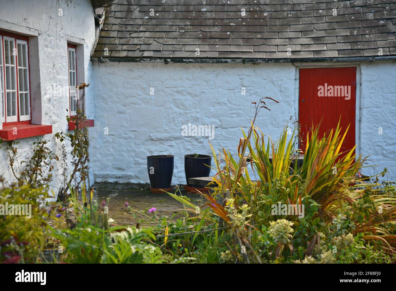 Original 19th century shingles roof cottage in the picturesque village