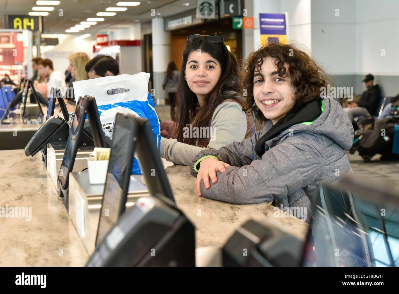 Real-life Latin American travelers in Pearson International Airport, Toronto, Canada Stock Photo