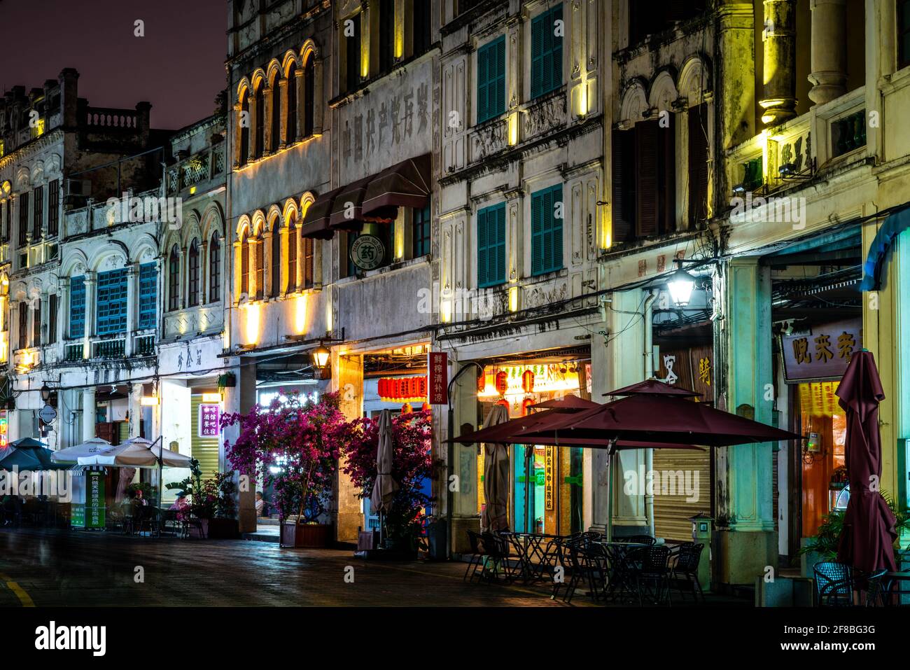 Haikou China , 23 March 2021 : Qilou or Zhongshan old street streetscape illuminated at night with colonial buildings in Haikou old town Hainan China Stock Photo