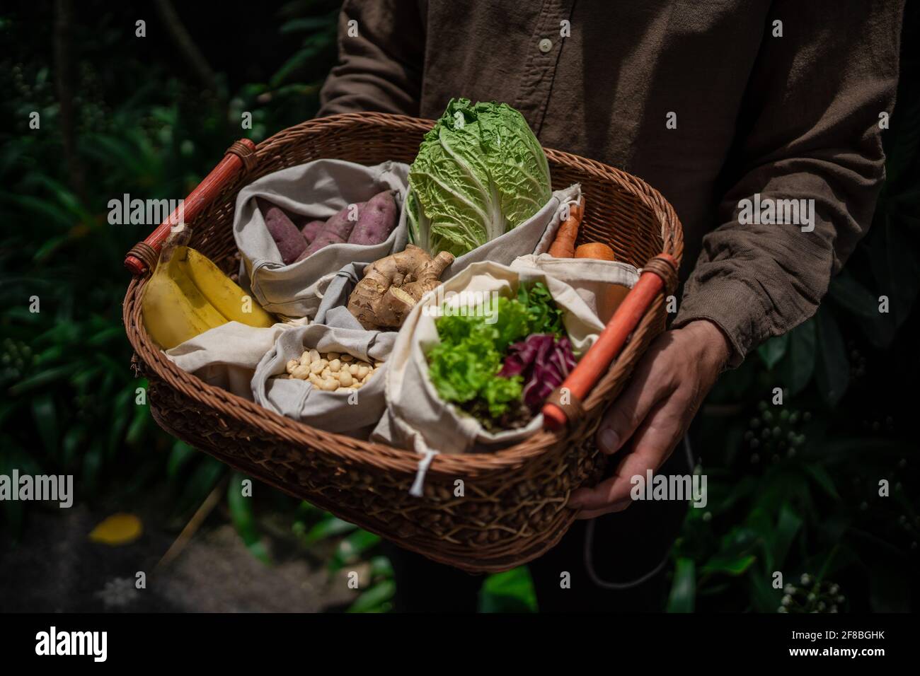 eco friendly and reusable zero waste cotton bags in basket Stock Photo