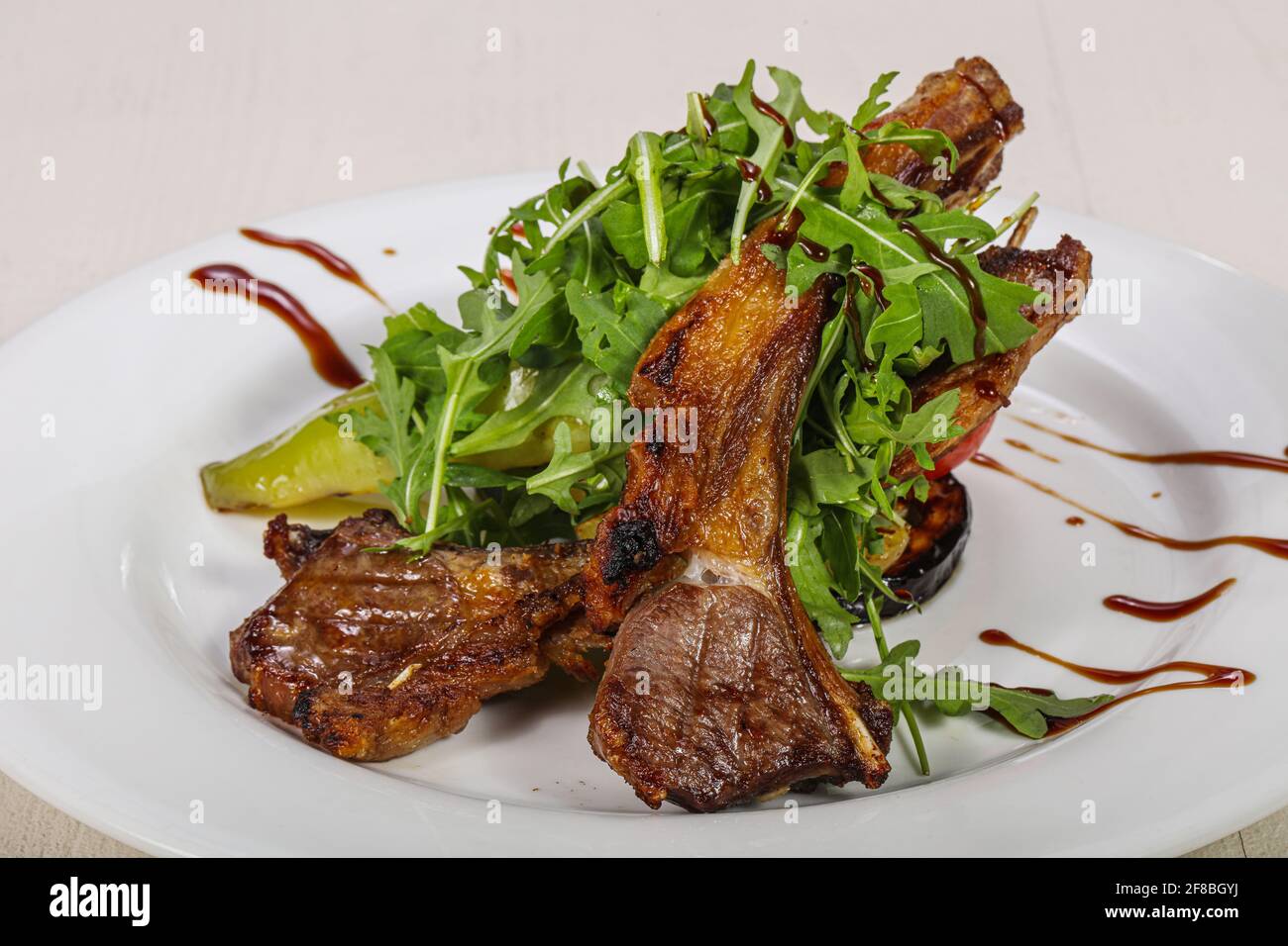 Tasty Grilled rack of lamb barbeque Stock Photo - Alamy