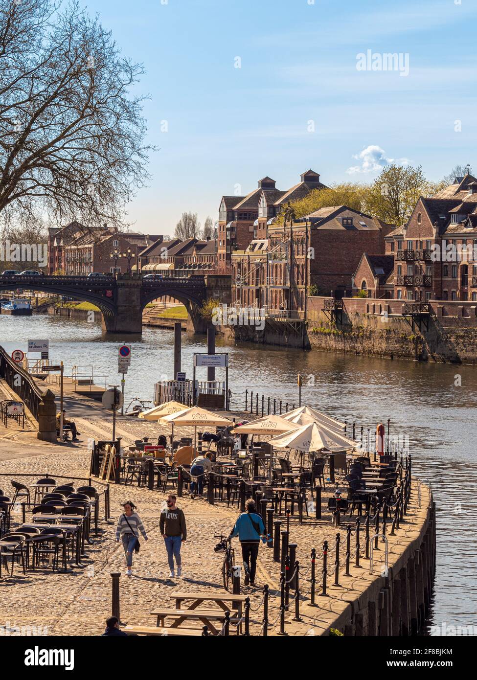 People enjoying meeting outdoors at cafes and bars in York city centre after easing of lockdown restrictions due to covid-19, April 2021. Stock Photo