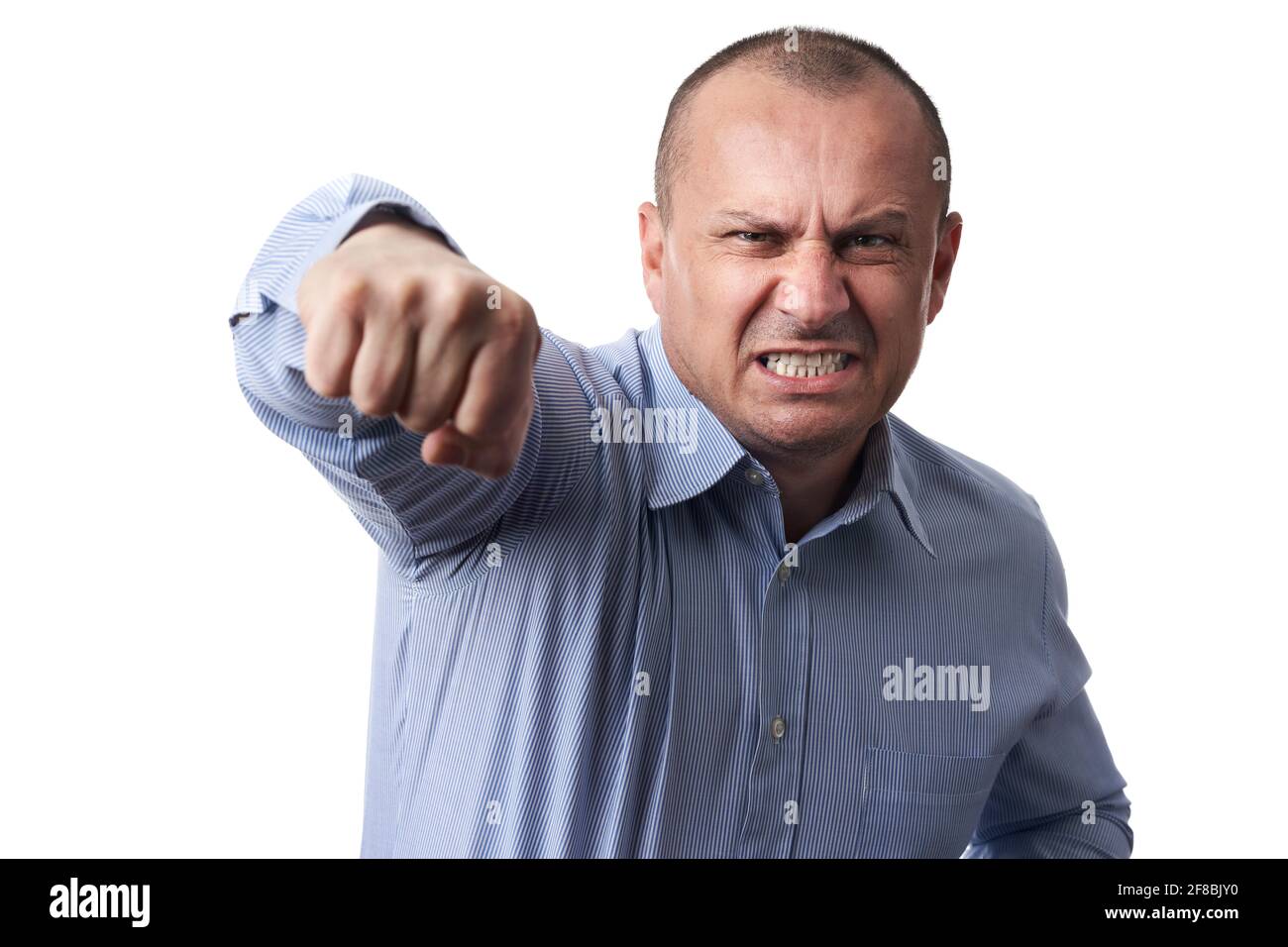 Angry businessman punching towards the camera in a rage, isolated on ...