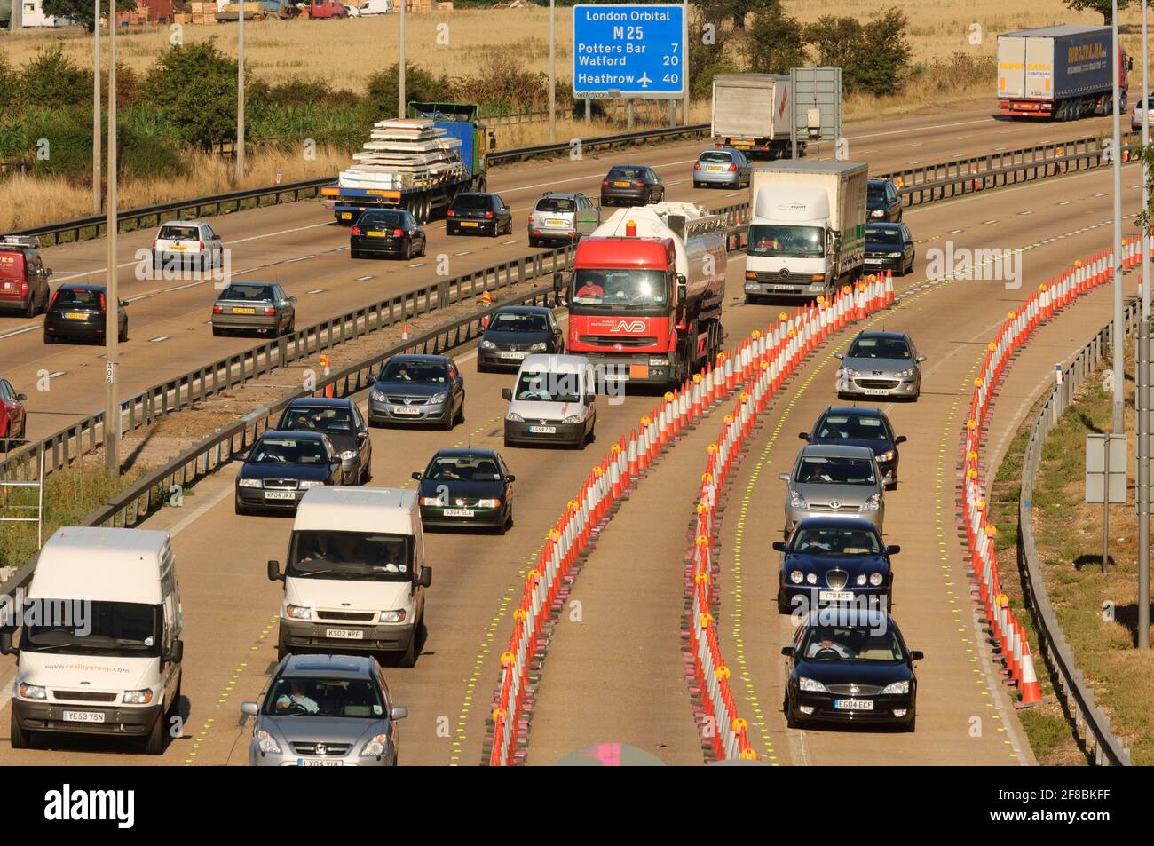 Traffic going through roadworks, M25 motorway between near Theydon Bois