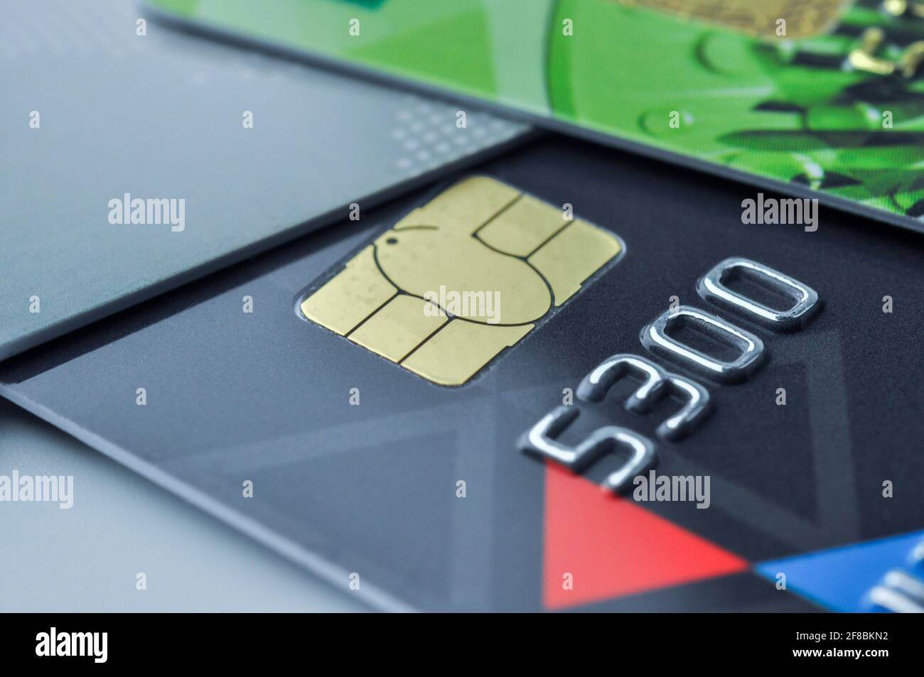 Credit cards and smart chip with shallow depth of field. Macro shot. E-commerce and cashless payment concept. Stock Photo