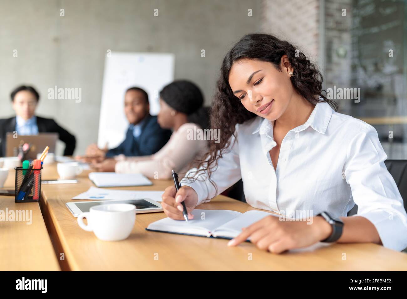 Coworkers writing hi-res stock photography and images - Alamy