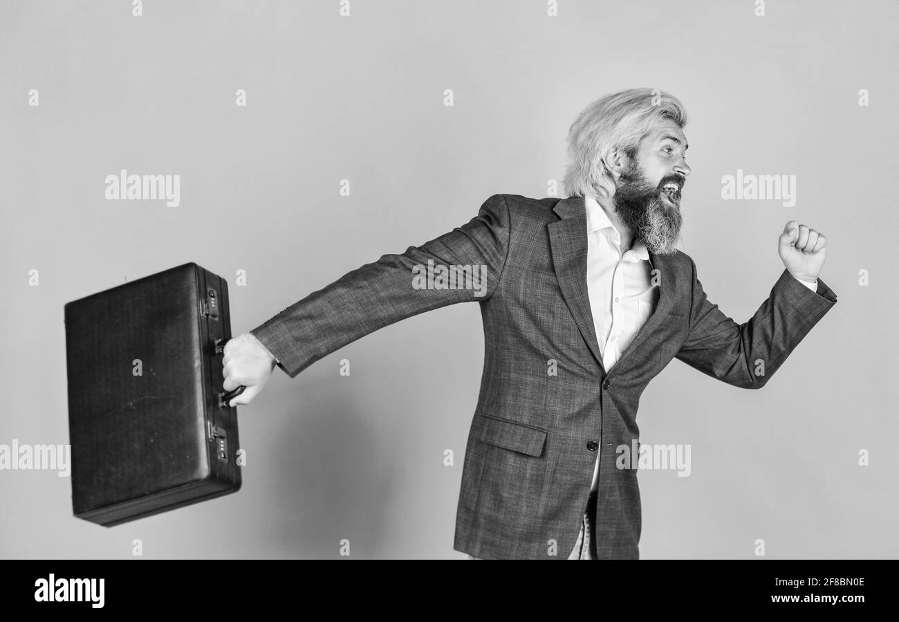 businessman hurry up with case. brutal mature man in jacket carry briefcase. running to business meeting. suitcase for office life. successful male Stock Photo