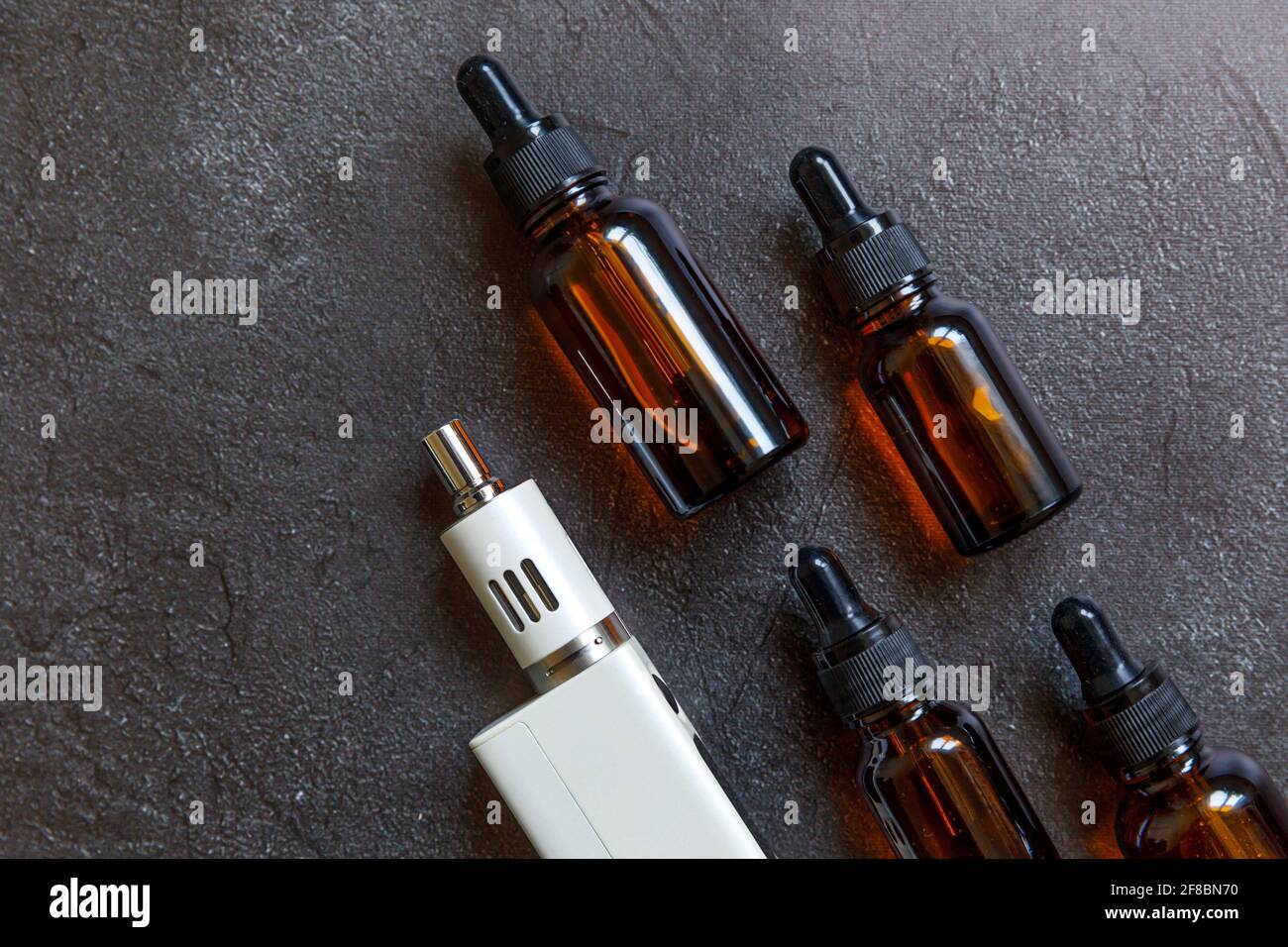 Vaping device ecigarette electronic cigarette and liquid bottles on