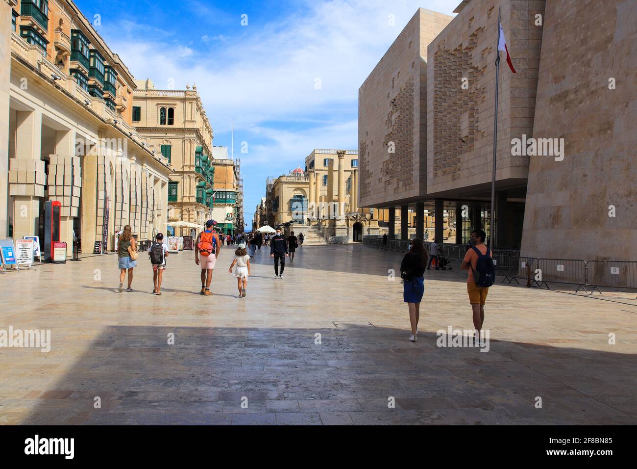 Valetta, Malta - October 22, 2020: Tourists walking along the Republic street of Valletta, Malta Stock Photo
