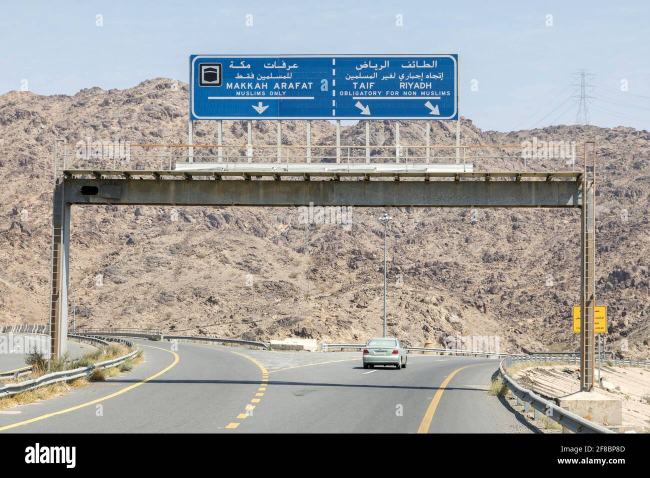 Makkah, Saudi Arabia, February 22 2020: Road sign in the vicinity of Mecca that non Muslims do have to drive around the holy city Mecca in Saudi Arabi Stock Photo