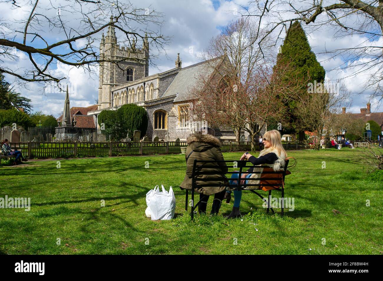 Beaconsifield, Buckinghamshire, UK. 13th April, 2021. Shoppers enjoy the  morning sunshine. Beaconsfield was getting busier today as people were out  and about enjoying the Spring sunshine and the next step in the