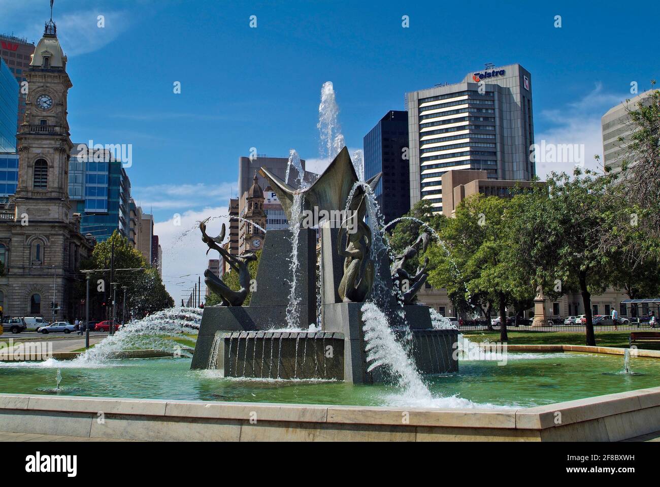 Adelaide, Australia - January 30, 2008: Unidentified people on Victoria Square with fountain and Victoria Tower Stock Photo