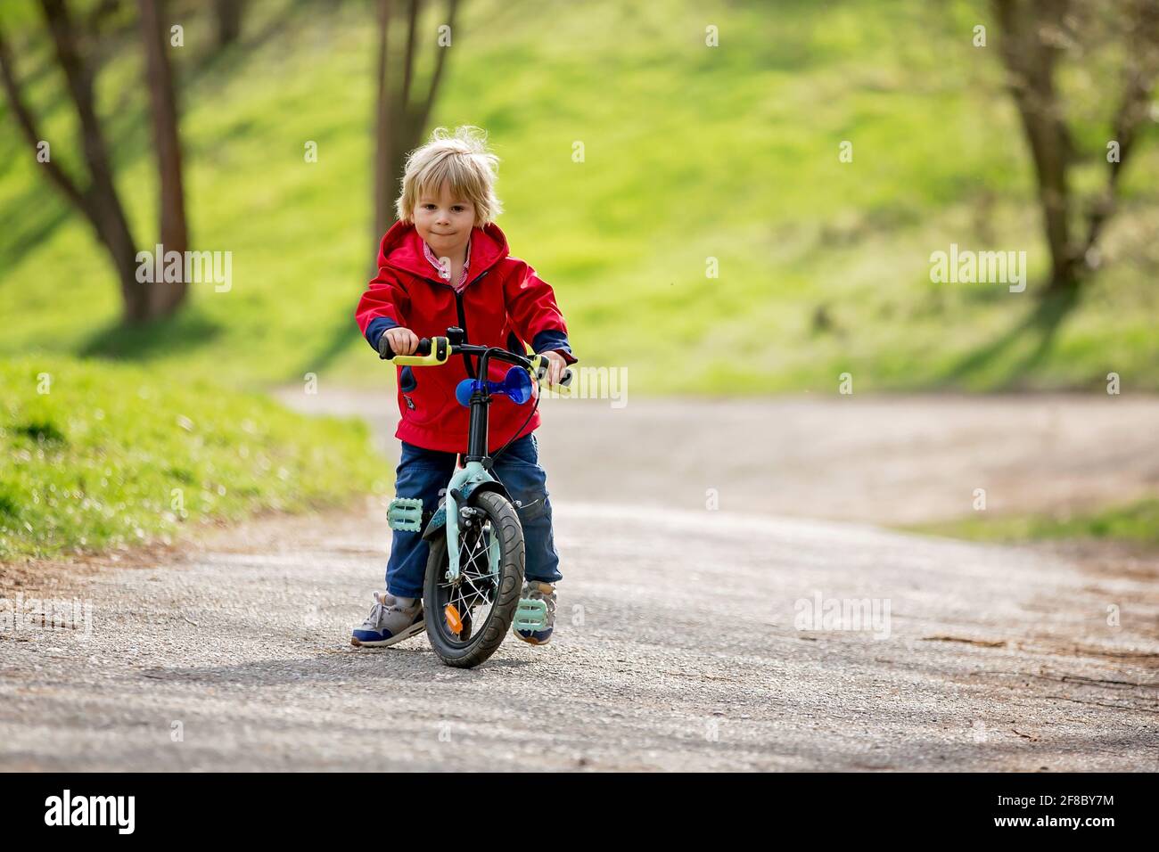 small boy driving bike