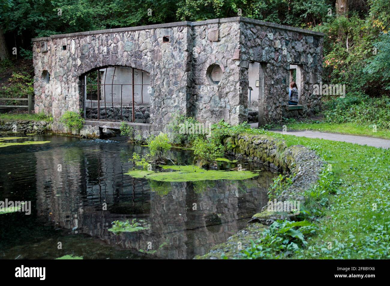 Ruins of Spring House Reflected in Water at Paradise Springs, Eagle WI Stock Photo