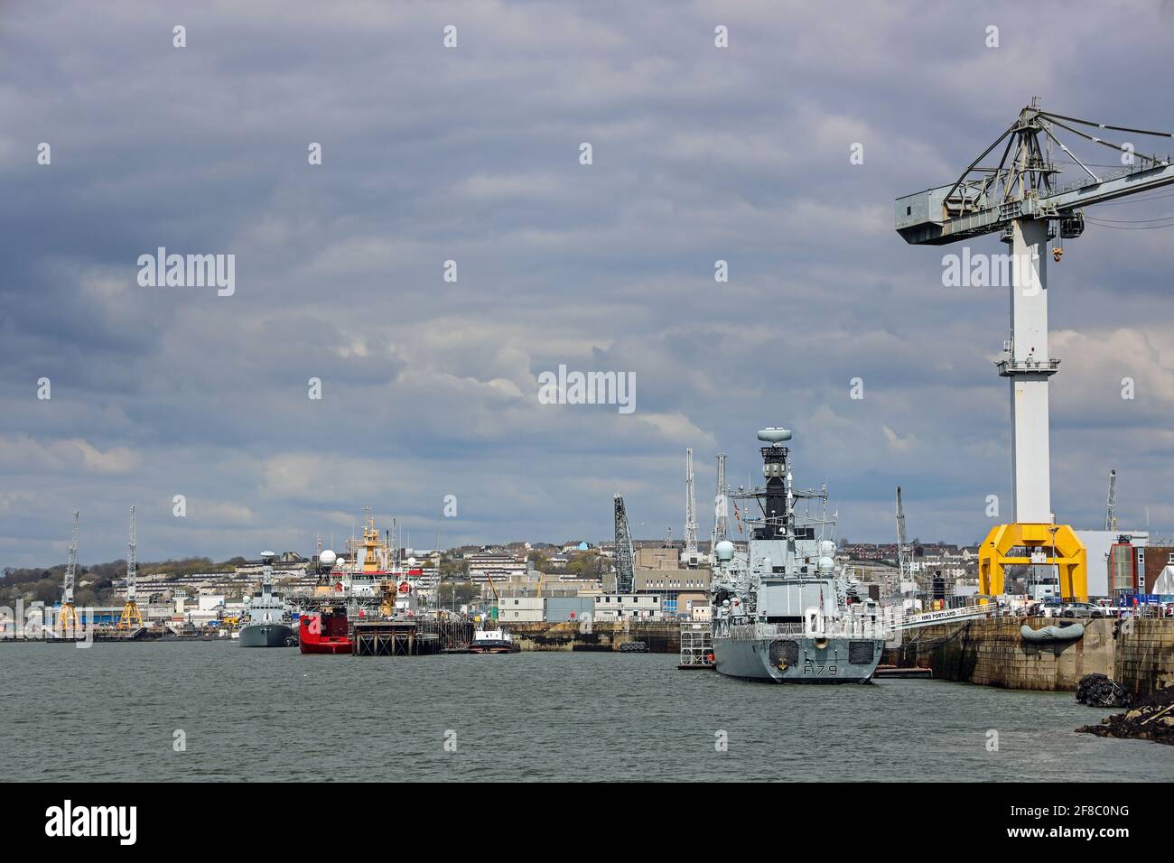 Ships berthed on the River Tamar at Devonport Dockyard. Defence giant Babcock International, operators at Devonport Dockyard, the largest naval base i Stock Photo