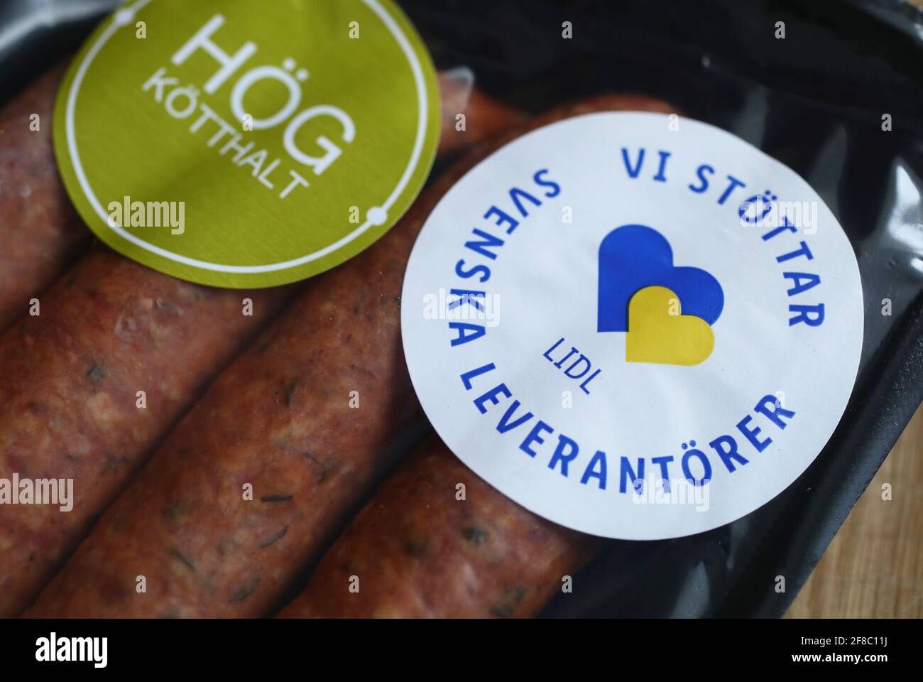 Sausages from Lidl. Text that Lidl supports Swedish suppliers Stock