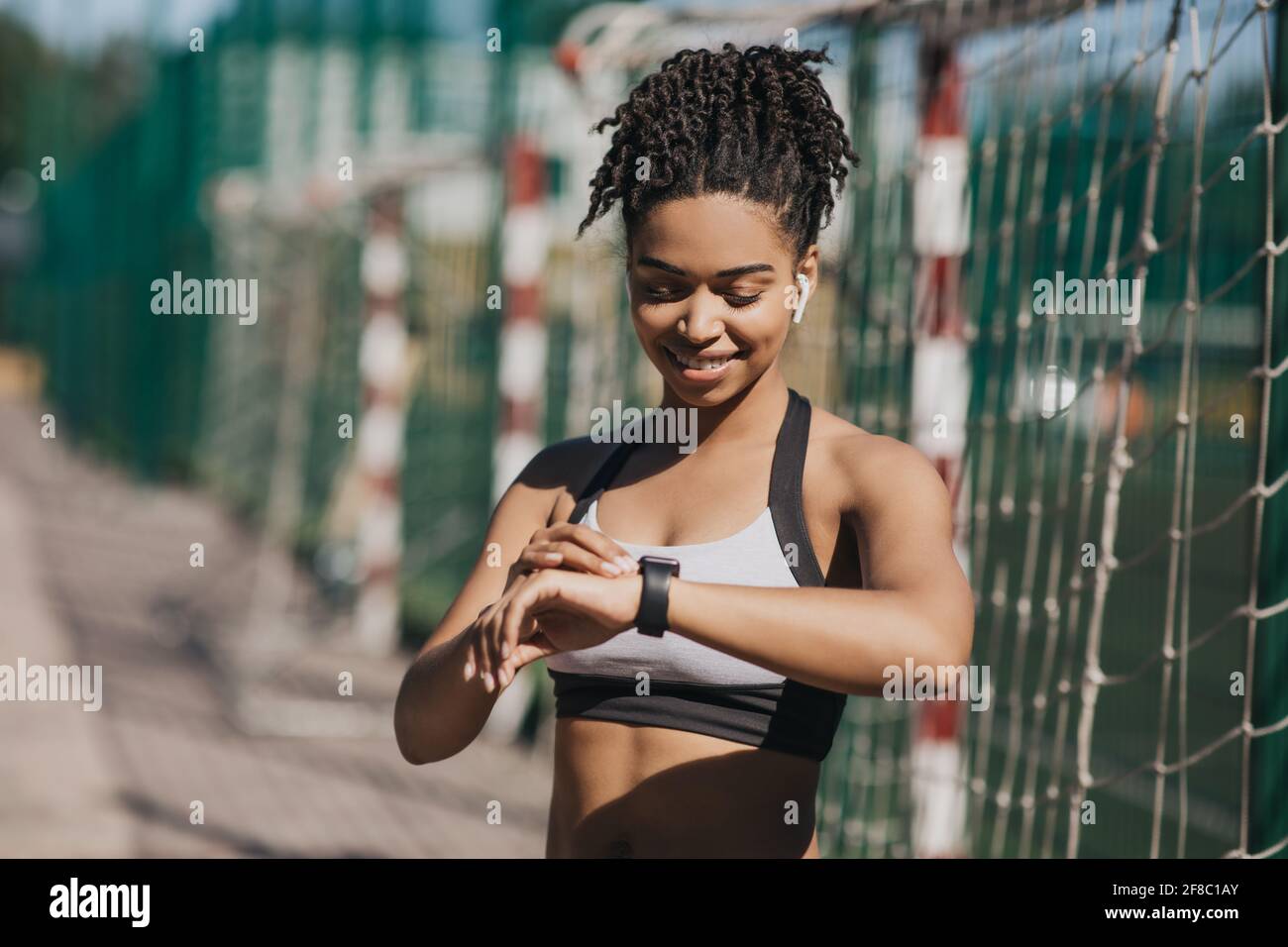 Beauty blogger and fitness trainer, working out outdoors Stock Photo