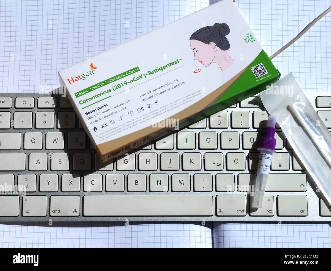 German hotgen Corona or Covid-19 home testing kit with a keyboard Stock Photo