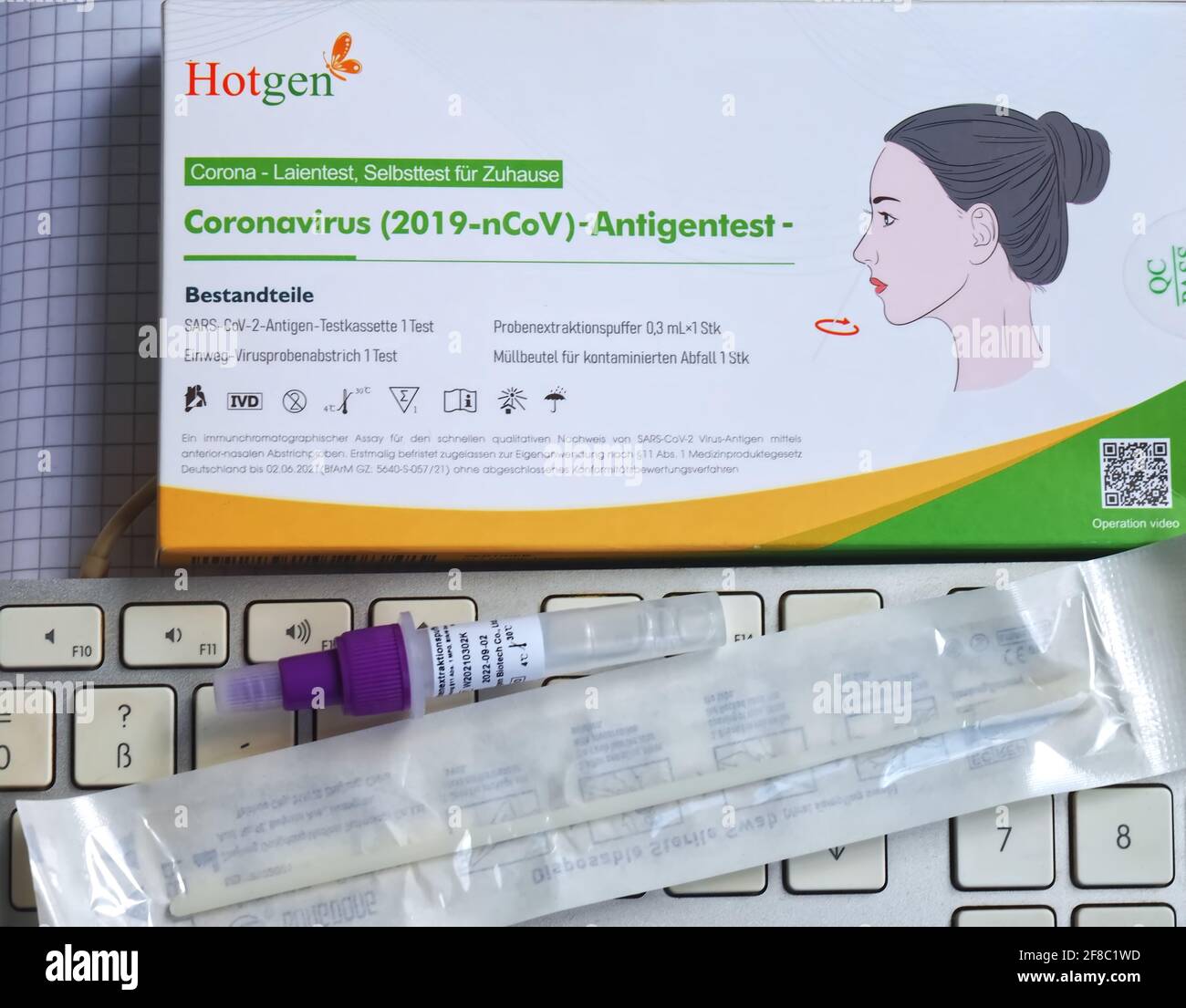 German hotgen Corona or Covid-19 home testing kit with a keyboard Stock Photo