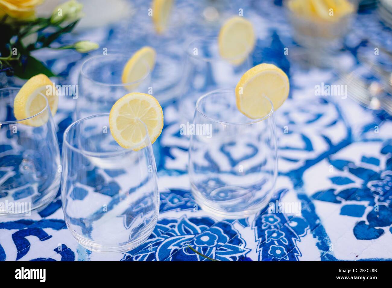 Navy blue and yellow table setting for outdoor wedding reception Stock Photo Alamy