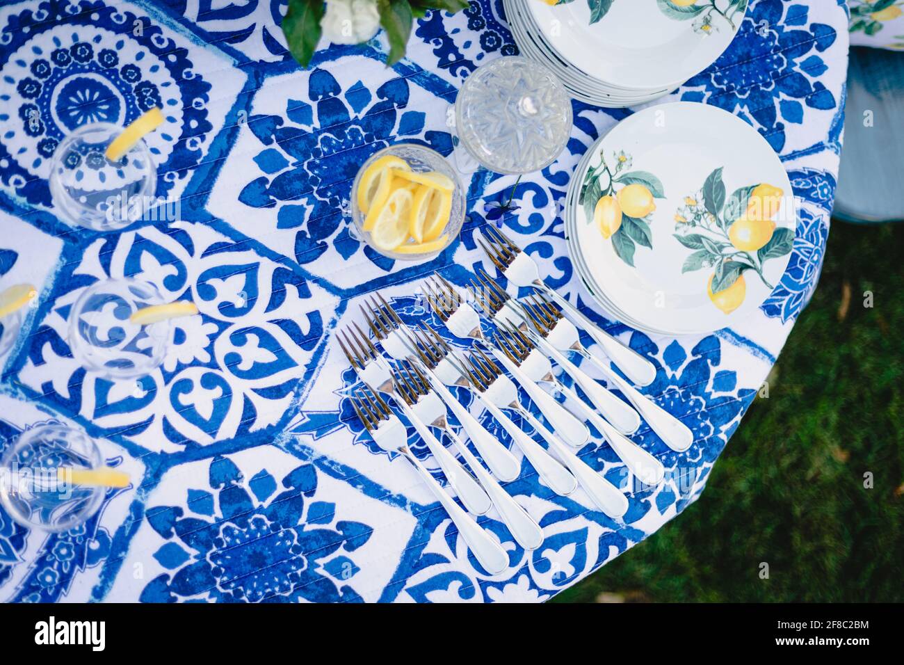 Navy blue and yellow table setting for outdoor wedding reception Stock