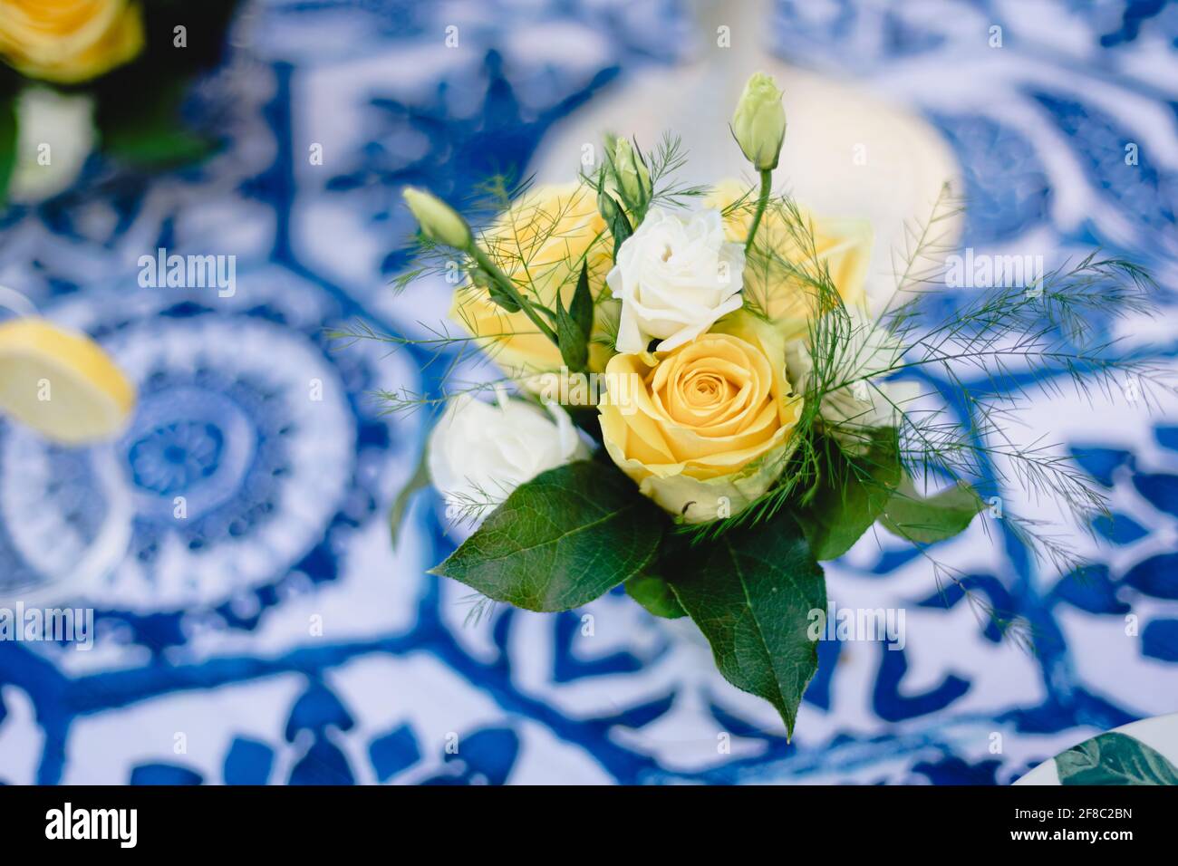 Navy blue and yellow table setting for outdoor wedding reception Stock Photo Alamy